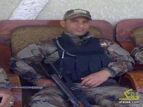 صورة للشهيد الشرطي أيوب خلف الذي احتضن الإرهابي الانتحاري وسط زوار الاربعين
